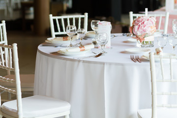 table setting with spoon, knife, plates and glass