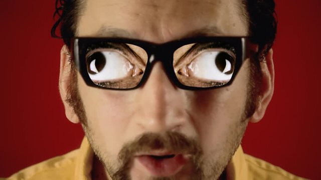 A funny ugly man with hypnotic glasses, showing big nervous eyes. Weirdness, surreal, dream.
