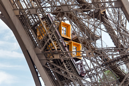 Elevator of the Eiffel Tower in Paris. France. The Eiffel Tower was constructed from 1887-1889 as the entrance to the 1889 World's Fair by engineer Gustave Eiffel.