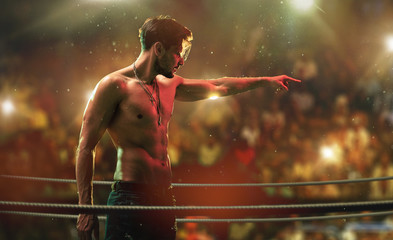 Handsome, muscular man on the fight club ring