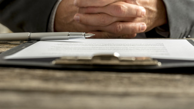 Businessman in a meeting with clasped hands