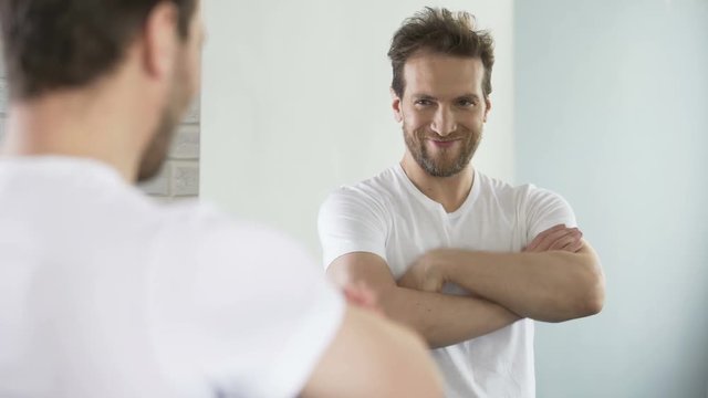 Self-centered man motivating and setting himself up for success during workday
