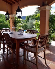 Terrace with wooden garden furniture in Provence, France