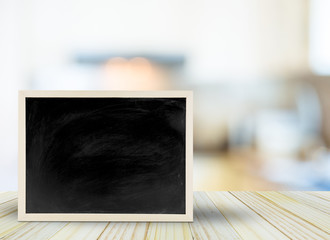 Blank chalkboard, blackboard on table with bokeh blur room background with copy space, Blackboard on table for graphic apply work about business, education or other