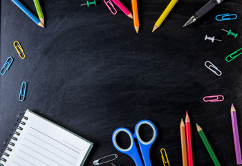 School supplies side border on a chalkboard background. School supplies on blackboard background. back to school, education concept