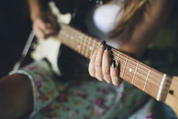Fototapeta premium Girl playing acoustic guitar