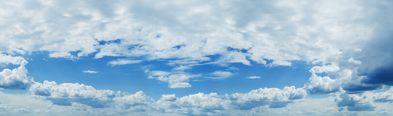 Sunny blue sky background with clouds Panorama Photo