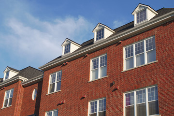 Fototapeta na wymiar house roof residential skylight dormer red brick wall facade