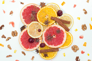 slices of oranges, lemons and grapefruits on vintage white table. Citrus fruit background. healthy eating with natural vitamins. Top view with copy space