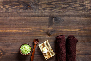 Plakat Relax concept. Handmade organic soap and bath salt on wooden table background top view copyspace