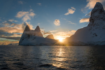 Sunrise over the mountains along the Antarctic Peninsula at the Lemaire Channel.