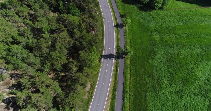 Korppoo, Cinema 4k aerial view above a road revealing Korpo town, on a sunny summer day, in the finnish archipelago outside Turku, Varsinais-suomi, Finland