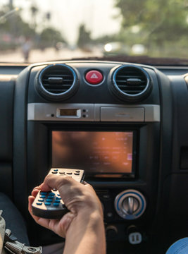 Remote control for compact disk player in a car
