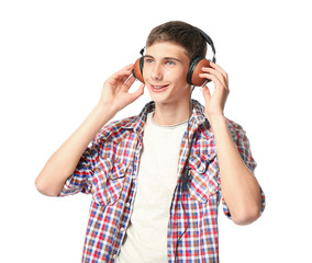 Happy smiling teenager with headphones on white background