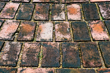 Grunge cobble stone pavement texture background.
