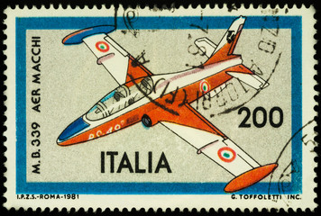 Light military aircraft Aermacchi MB-339 on postage stamp