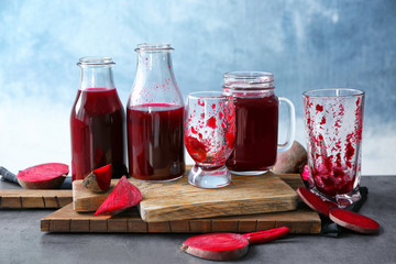 Composition with beetroot smoothie and glassware on table