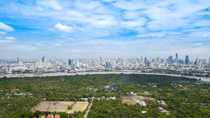 Aerial View of Bangkok skyline and view of Chao Phraya River View from green zone in Bang Krachao, Phra Pradaeng, Samut Prakan Province.