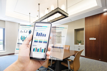 smart phone with business report in modern office