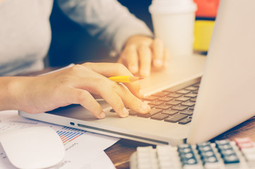 Team businessman job . working with laptop in open space office. Meeting report in progress. sun glare effect