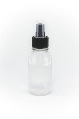 Transparent spray bottle on a white background