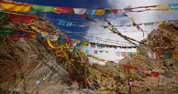 4k Prayer flags at the lake namtso in tibet,ancient holy monk meditation in cave,ZhaXi Peninsula,tibet mansarovar,Tibet's second largest lake,is the third largest saltwater lake in China.