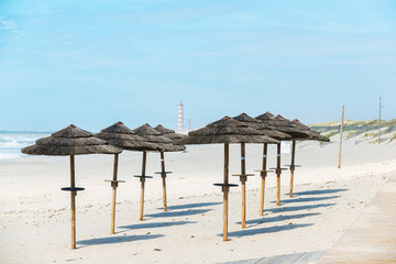 Beach umbrellas. Costa Nova beach. Aveiro.  Portugal