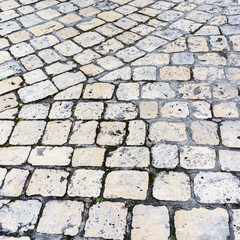 Stone pavement road in the old town of Cognac , France