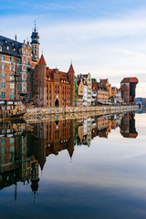Embankment of Motlawa river with reflection on water, Gdansk
