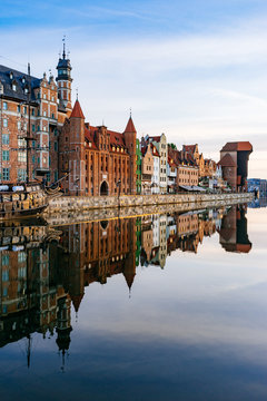 Fototapeta Embankment of Motlawa river with reflection on water, Gdansk