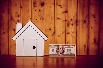 paper houses stands over a wooden background