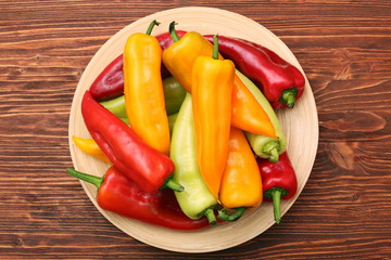 Fresh colored sweet peppers on the plate