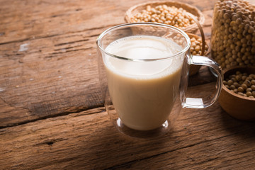 Glass with Soy Milk and Seeds on background