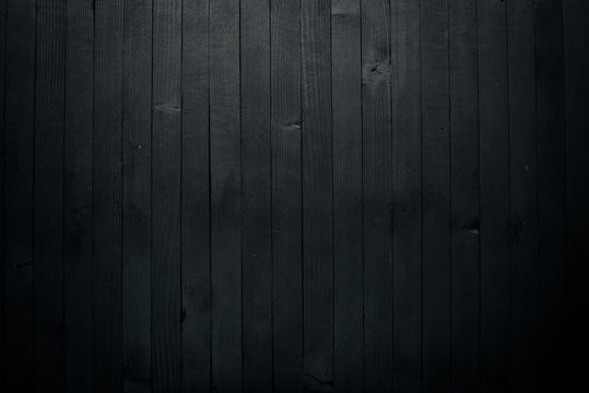 Wooden black texture surface. Top view. Free space for your text.