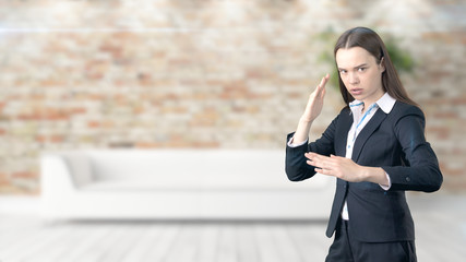 Young beautiful business woman and creative designer standing over blured interior background