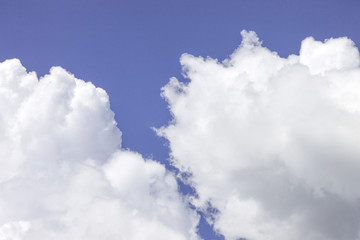 glowing white cloud floating on a rich blue sky