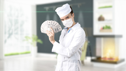 Beautiful medical woman doctor in uniform. Studio painted background. Concept of profitable health care.