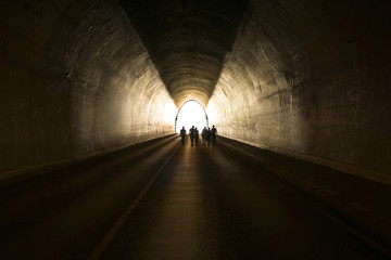 People going to the light at the end of the tunnel - obrazy, fototapety, plakaty