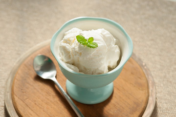 Ice cream in bowl and spoon 