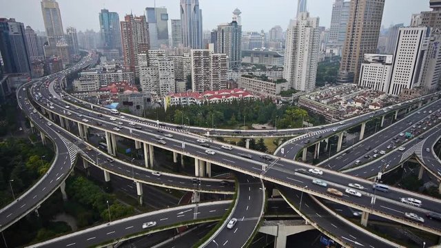Aerial View of freeway busy city rush hour heavy traffic jam highway,shanghai Yan'an East Road Overpass interchange,time lapse.