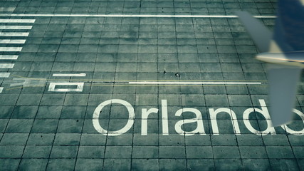 Obraz premium Aerial view of an airplane arriving to Orlando airport. Travel to the United States 3D rendering