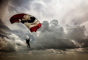 Skydiver in the background of cumulus clouds in the sky