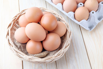 fresh chicken egg on wooden background