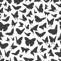 Fototapeta na wymiar Flying butterflies silhouettes seamless pattern