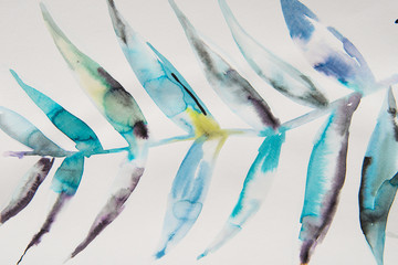Obraz na płótnie Canvas Close-up view of beautiful watercolor tropical leaves drawn on paper