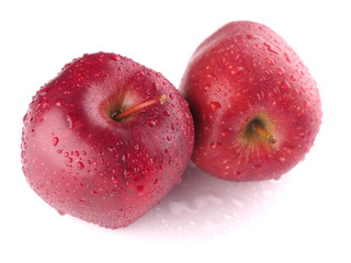 Red apple on a white background with droplets