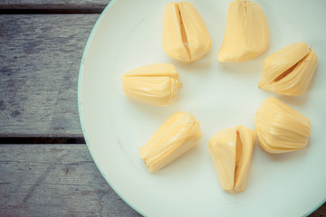 Fresh jackfruit in the bowl on wood table.