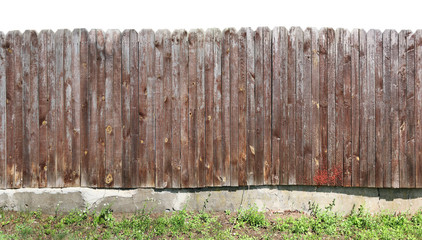 Crooked ugly wooden rural fence isolated on top.