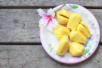 Fresh jackfruit in the bowl on wood table.