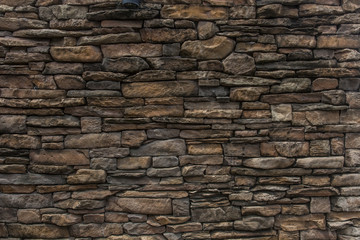 pattern gray color of modern style design decorative uneven cracked real stone wall surface